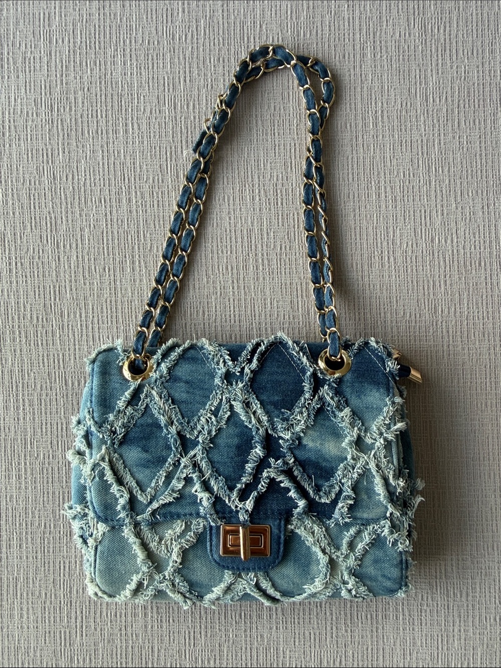 Denim quilted shoulder bag